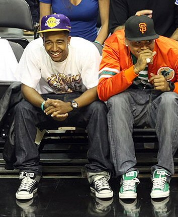 Chris Brown wearing Green Chuck Taylors