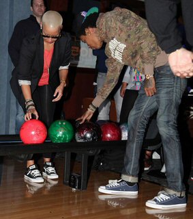 Wiz Khalifa wearing Navy Blue Chuck Taylors