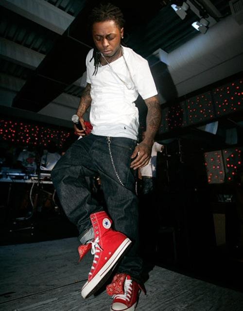 Lil Wayne wearing Red Chuck Taylors